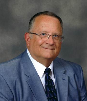 A person in a suit and tie

AI-generated content may be incorrect.